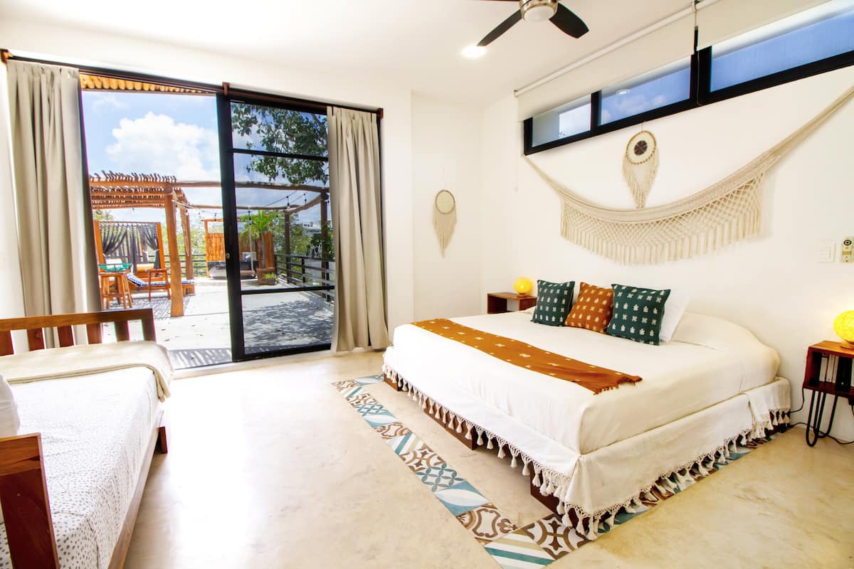 Bright bedroom with natural cotton coverlet